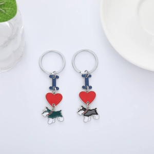 Detailed macro view of creative schnauzer dog keychains with bone and heart charms