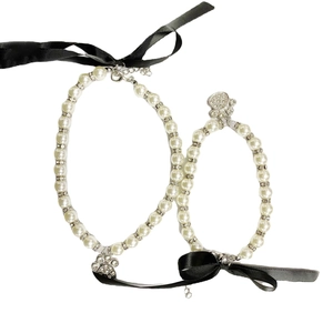 Elegant pearl pet collar with black bow and rhinestone paw pendant for cats and small dogs