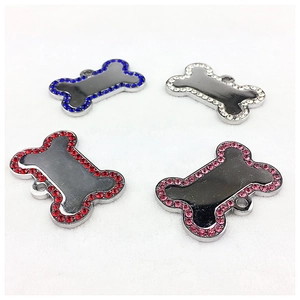 Top view of bone shaped pet ID tags in four colors with sparkling rhinestone edges