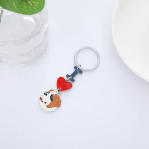 Close-up of Saint Bernard dog keychain with enamel red heart and letter pendant