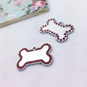 Silver bone-shaped pet ID tag with red rhinestones for custom laser engraving