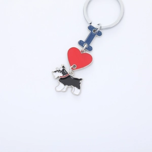 Zinc alloy keychain with blue letter I, red heart, and Scottie dog charm on white background