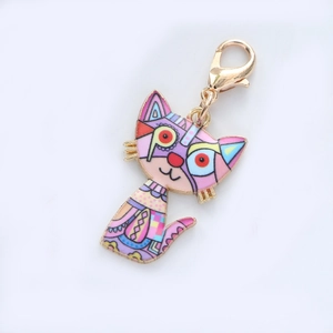 Colorful geometric cat enamel keychain with gold frame and lobster clasp on white background