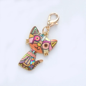 Macro detail of cartoon cat alloy keychain with colorful enamel drip oil finish and lobster clasp