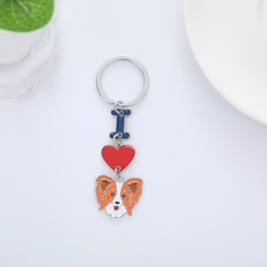 Cute Papillon dog keychain with heart charm and blue letter I on a metal silver ring