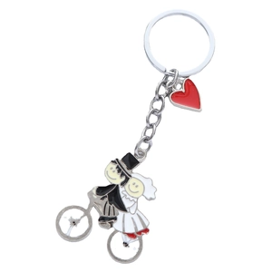 Cartoon bride and groom on bicycle keychain with red heart charm for wedding gifts