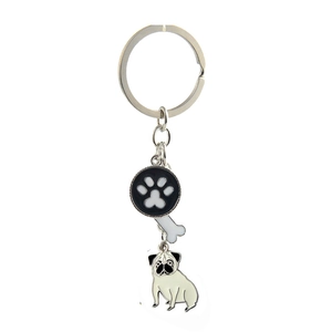 Detail of silver metal pet keychain with pug, paw print, and bone pendants