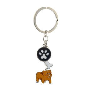 Detail of metal keychain featuring paw print, white bone, and bulldog enamel charms