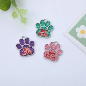 Glitter paw-shaped pet ID tags with Wet Kisser text for dogs and cats in multiple colors