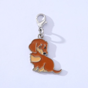 Detail of dachshund dog keychain with brown enamel finish and silver lobster clasp