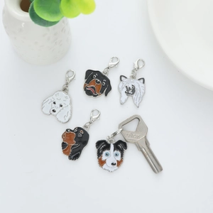 Five colorful enamel dog breed charms with silver lobster clasps for keys or bags
