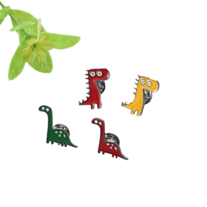 Lot de quatre broches dinosaures colorées en émail avec fermoirs papillon sécurisés