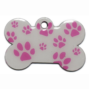 Bone-shaped pet ID tag with pink paw prints on white metal surface for dog collars