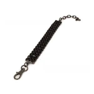 Close-up of three-row black crystal pet collar with lobster clasp and adjustable chain