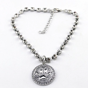 Silver pet necklace with a paw print pendant and sparkling crystal rhinestones link chain