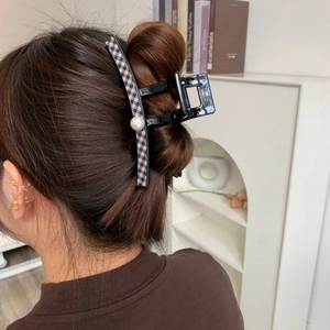 Large PVC hair claw clip with black and white checkerboard pattern and pearl detail