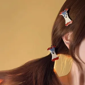 Detail view of apple core shaped hair clip with blue plaid bow on long brown hair