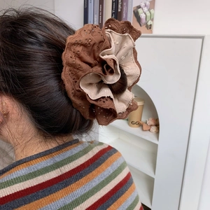 Retro oversized layered lace scrunchie in brown and cream for an elegant bun hairstyle
