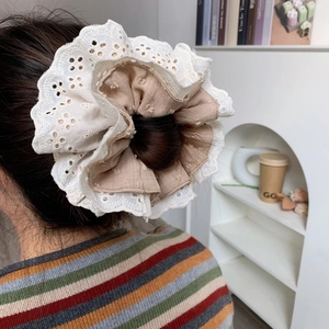 Elegant four-layer oversized lace scrunchie with embroidery shown on a ponytail