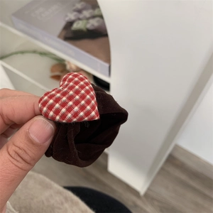 Brown scrunchie featuring a sweet red and white checkered fabric heart decoration
