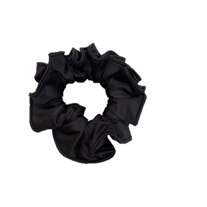 Elegant black pleated satin scrunchie with a thick texture for stylish ponytails