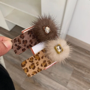 Sweet leopard print hair clips with plush faux fur balls and sparkling crystals