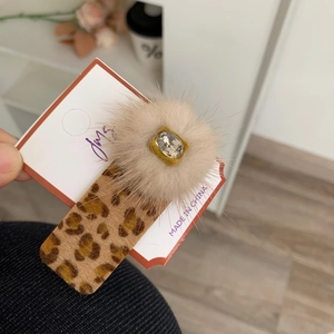 Elegant leopard hair clip with beige faux fur pom and sparkling diamond center