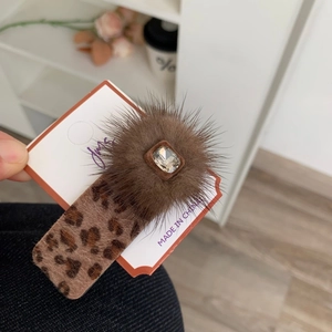 Elegant leopard print hair clip with faux mink fur and a rectangular rhinestone centerpiece