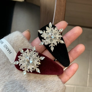 Handmade velvet snowflake hair clips with rotating crystals in black and burgundy red
