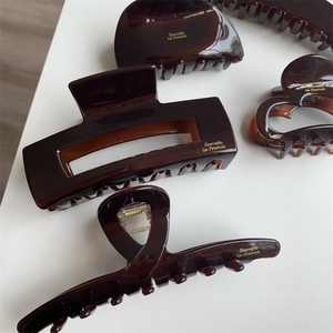 French tortoiseshell hair claws in assorted shapes with premium gold logo finish