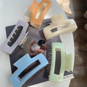 Macro shot of large rectangular hair claws in various soft macaron pastel colors