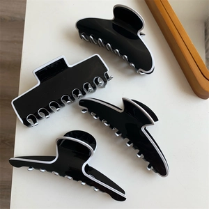 Pinces à cheveux françaises noir et blanc avec contours élégants en résine en quatre modèles