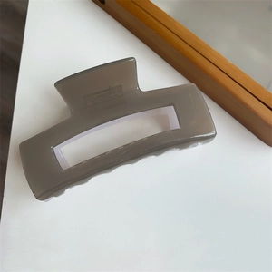 Detailed view of large translucent grey square hair claw clip with cutout design