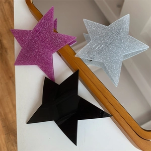 Trendy irregular star spring hair clips in black, silver glitter, and purple glitter