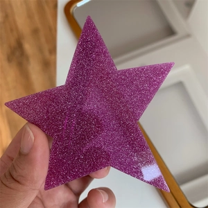 Detailed view of trendy purple glitter star hair clip with high density sparkle finish