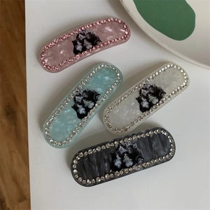 Sparkling crystal cat pattern hair clips in pink, blue, white, and black marble textures