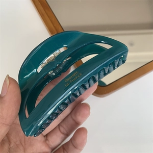 Dark green acetate hair claw clip with golden Barrette La France text for thick hair