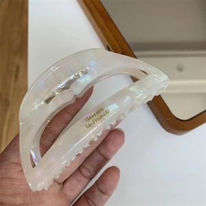 Large creamy white pearlized acetate hair claw with gold Barrette la France lettering