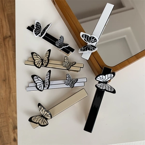 Elegant French vintage butterfly hair clips set in black, white, and beige colors