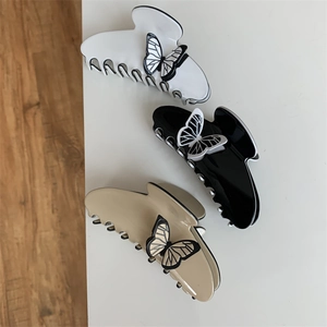 Three elegant French vintage butterfly hair claws in black, white, and milk tea color