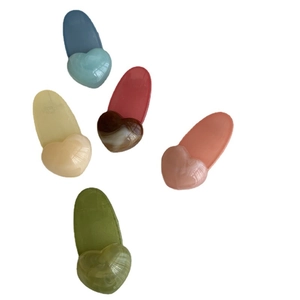 Five heart-shaped colorful jelly hair clips in blue, marble red, beige, pink and green