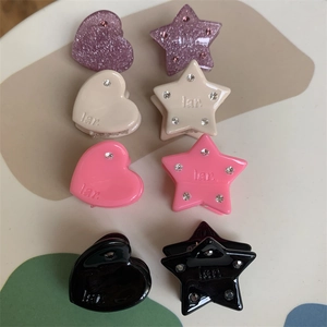 Detailed set of 8 mini star and heart hair clips with rhinestones in diverse colors
