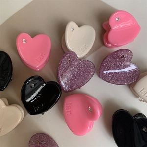 Mini heart-shaped hair clips set with rhinestones in pink, black, and white colors