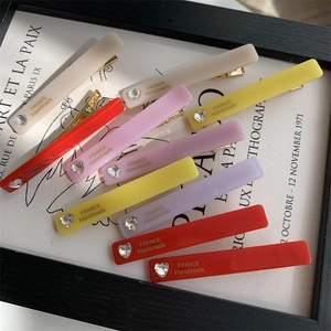 Detailed set of acrylic hair clips in pastel colors with heart rhinestones and duckbill metal