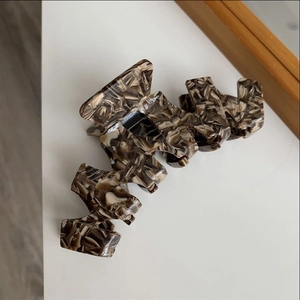 Elegant large brown marble acetate hair claw clip with unique sawtooth geometric design