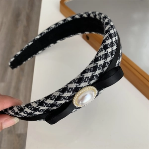 Elegant houndstooth headband with bow and large pearl detail in French vintage style