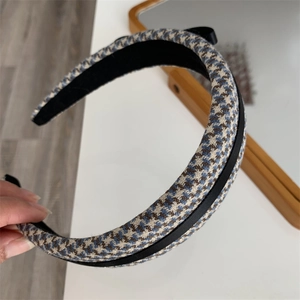 Detail of blue houndstooth check headband with thick padded texture and non-slip lining