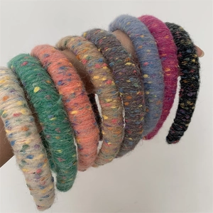 Rainbow knit headband set in thick plush yarn with colorful speckles and high top style