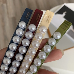 Elegant set of geometric pearl hair claws in navy, burgundy, beige, and olive green colors
