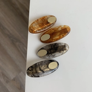 Elegant 4-piece set of oval acetate hair clips in tortoise shell and ink patterns